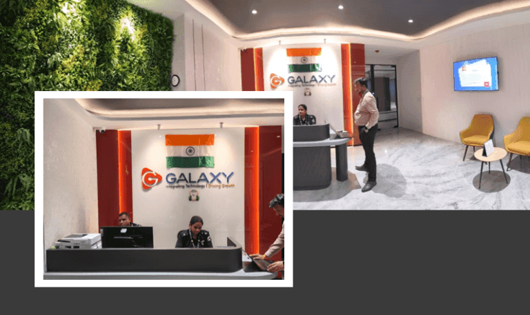 Modern office reception at Galaxy Training Solutions with staff, Indian flag, and prominent company branding.